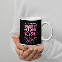 Load image into Gallery viewer, Mug with 'Just a Girl Who Loves K-Pop' text held by a person against a gray background